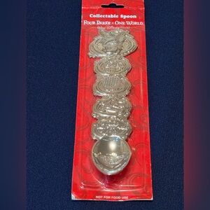 Disney World Silver Spoon that has all of the Park Icons